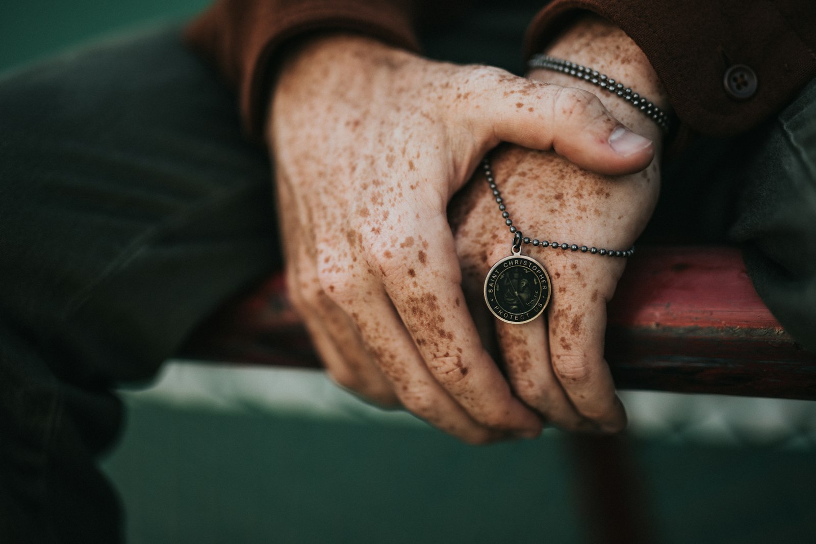 Sigma 50mm F1.4 EX DG HSM sample photo. Person holding round gold-colored photography