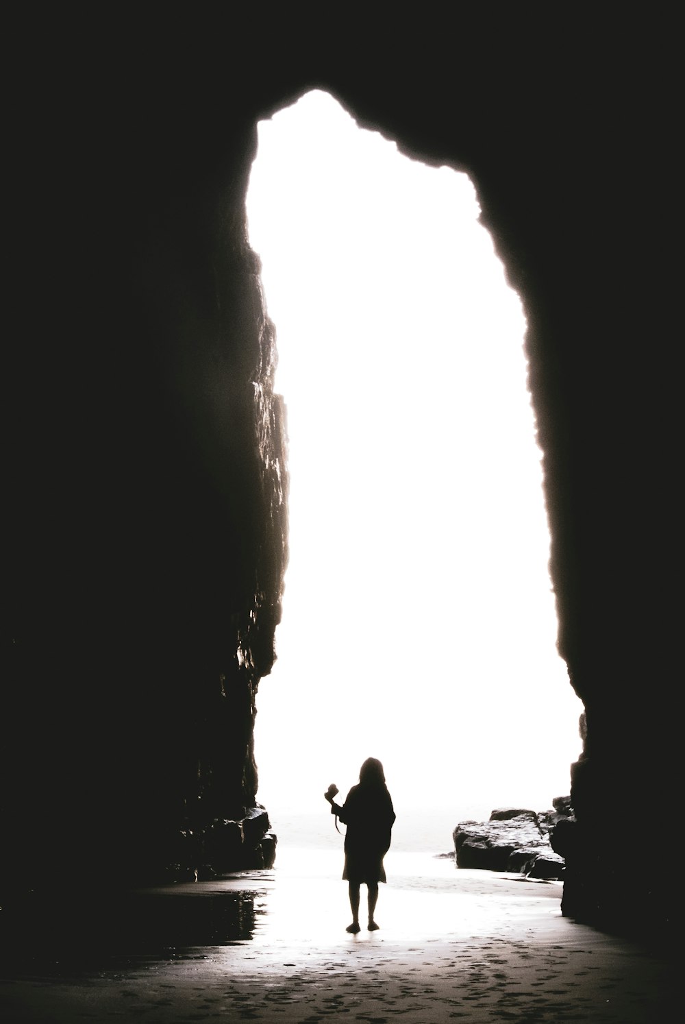 person standing in cave