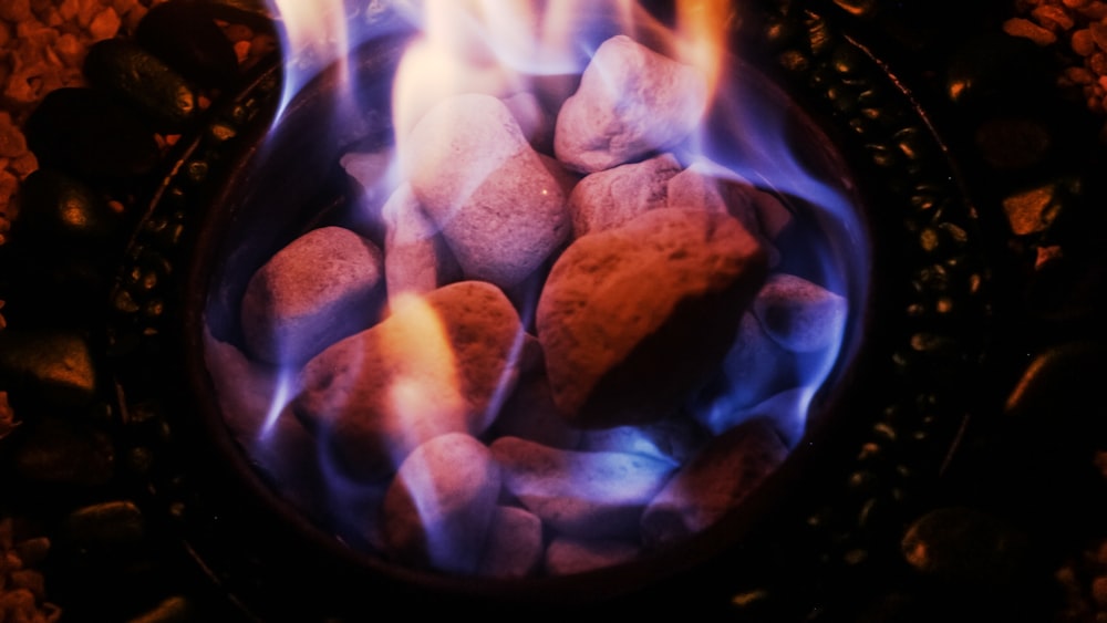 assorted stones with fire in fire pit