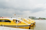 Aerial view of multiple water taxis operating on a river during flood season.