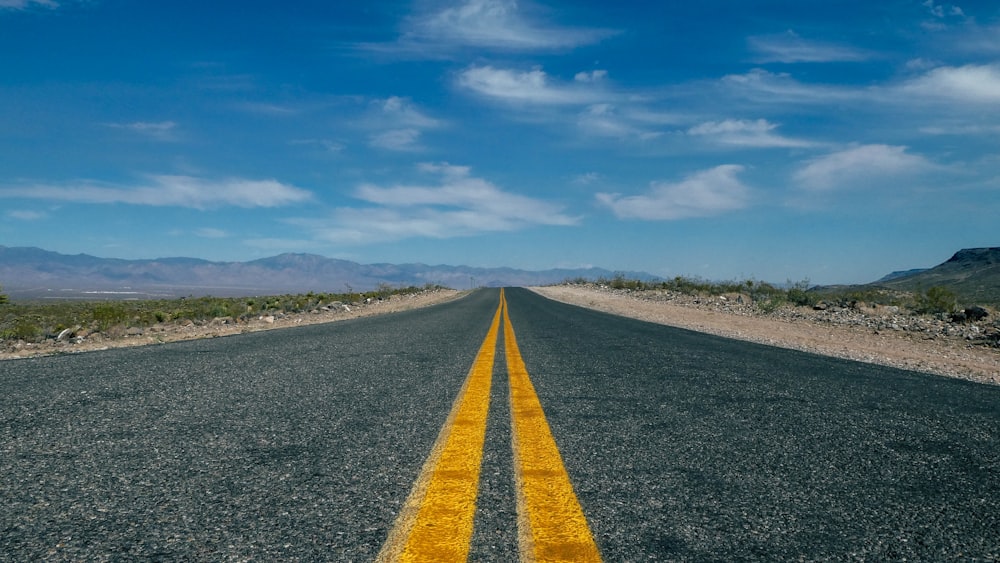 yellow double line on asphalt road