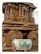A hand is holding a 50 rupee Indian banknote in front of an intricately carved stone chariot at a historical site. The chariot features detailed sculptures and ornate designs, with large stone wheels and pillars.