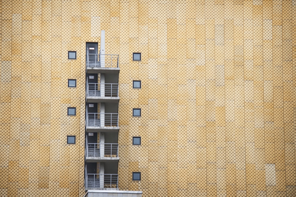 white metal railings between windows