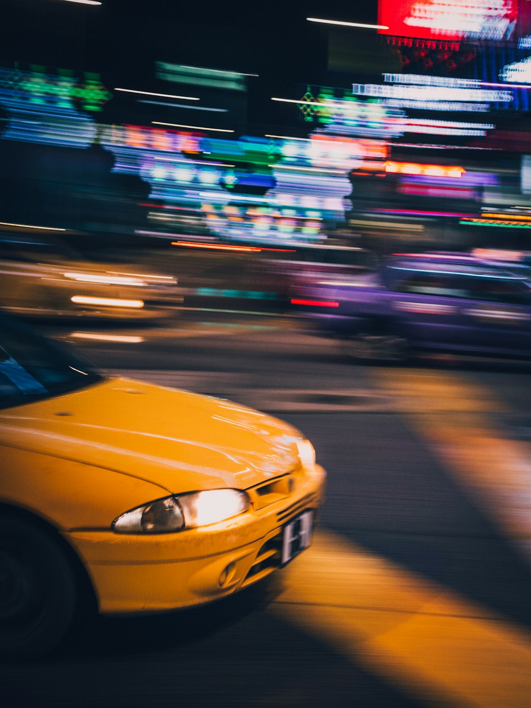 selective focus of yellow vehicle on road