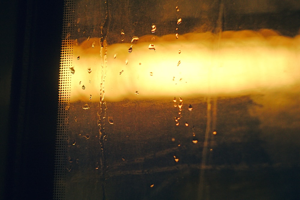 a close up of a window with rain on it