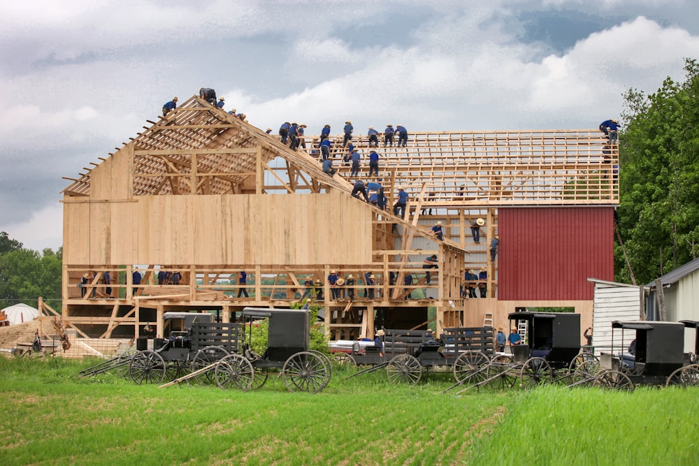 people making house during daytime