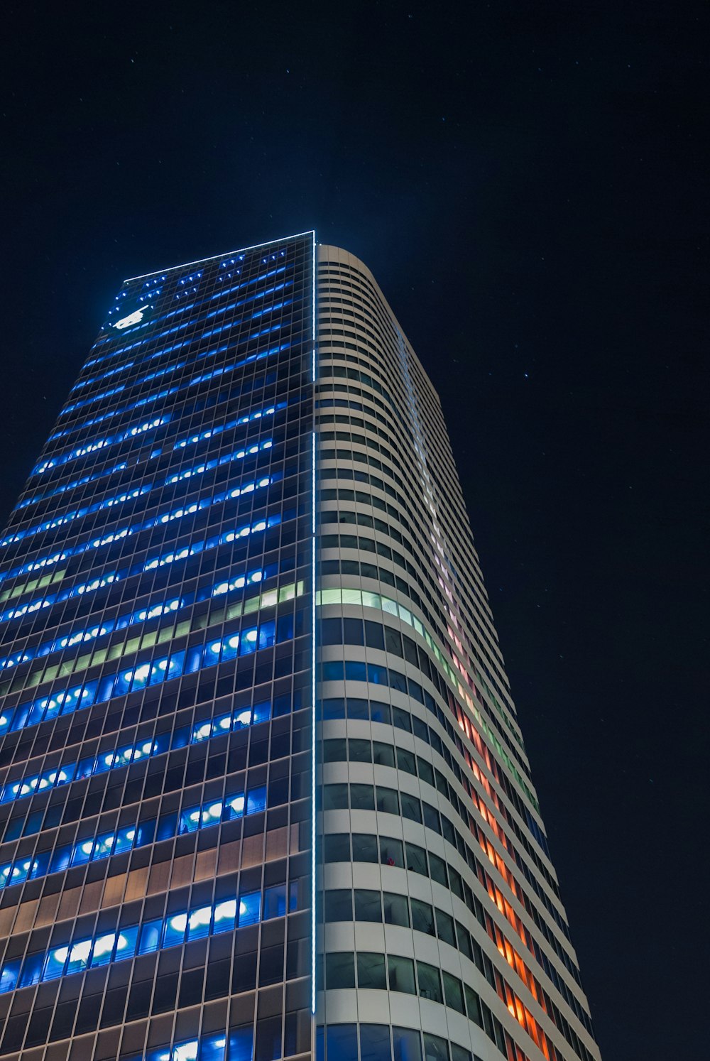 white and blue building at night