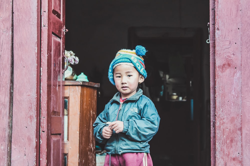 boy wearing black denim jacket