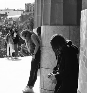 A diverse group of photographers capturing images in a vibrant urban setting.