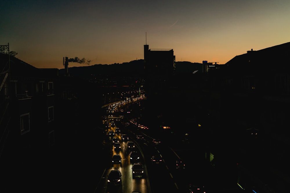 a city street filled with lots of traffic at night