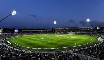 Cricket rivalry match under stadium lights