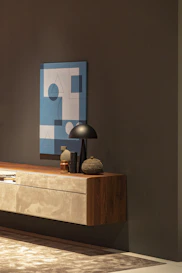 gray table lamp on brown sideboard