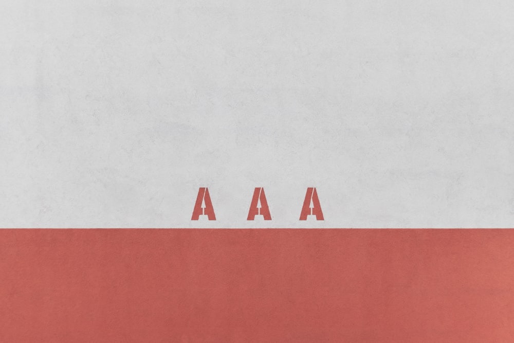 a red and white background with the word aa on it