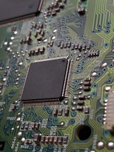 close-up photography of green motherboard