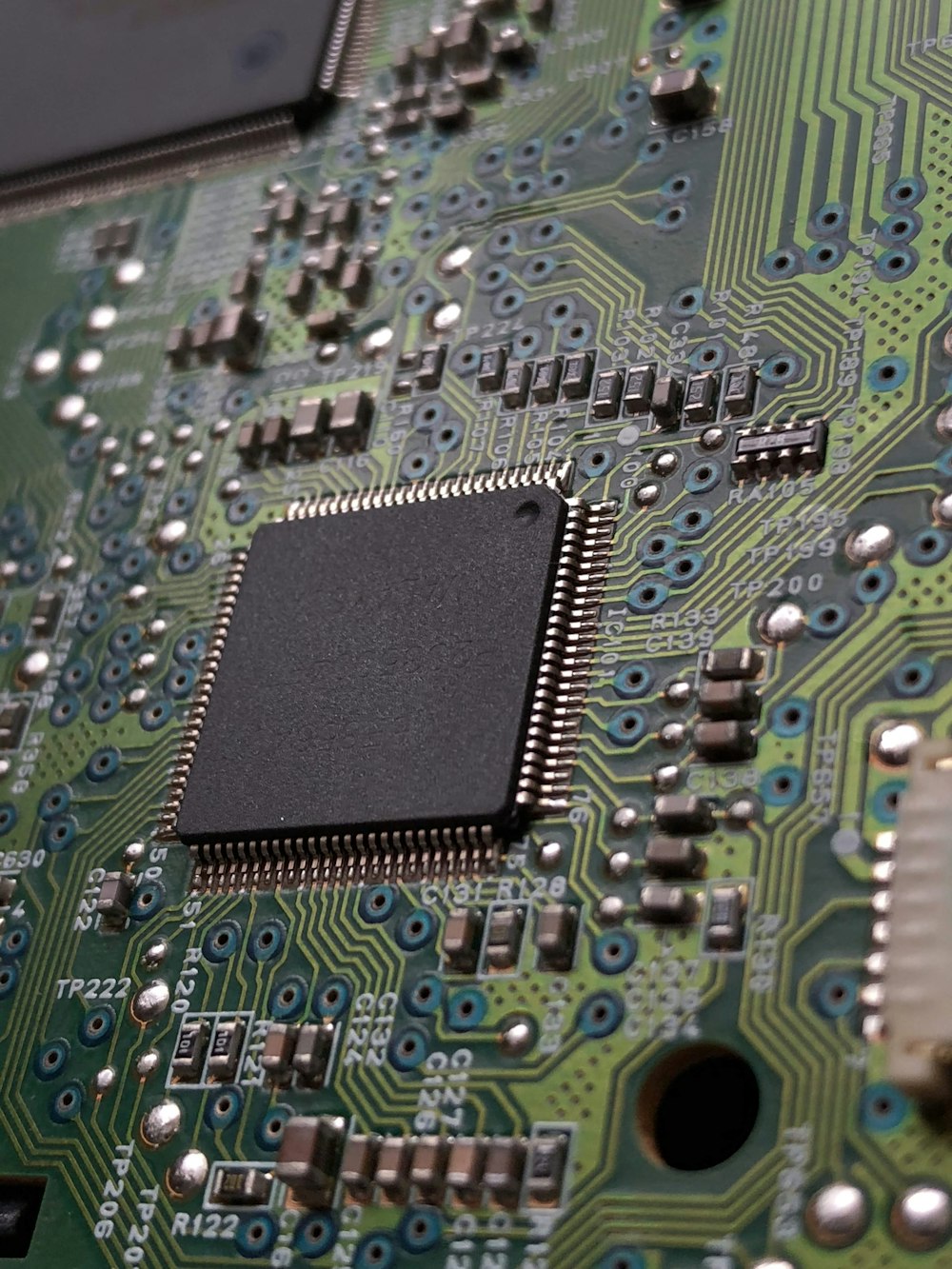 close-up photography of green motherboard