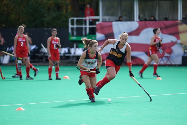 Young female hockey player in action on the ice during a game.