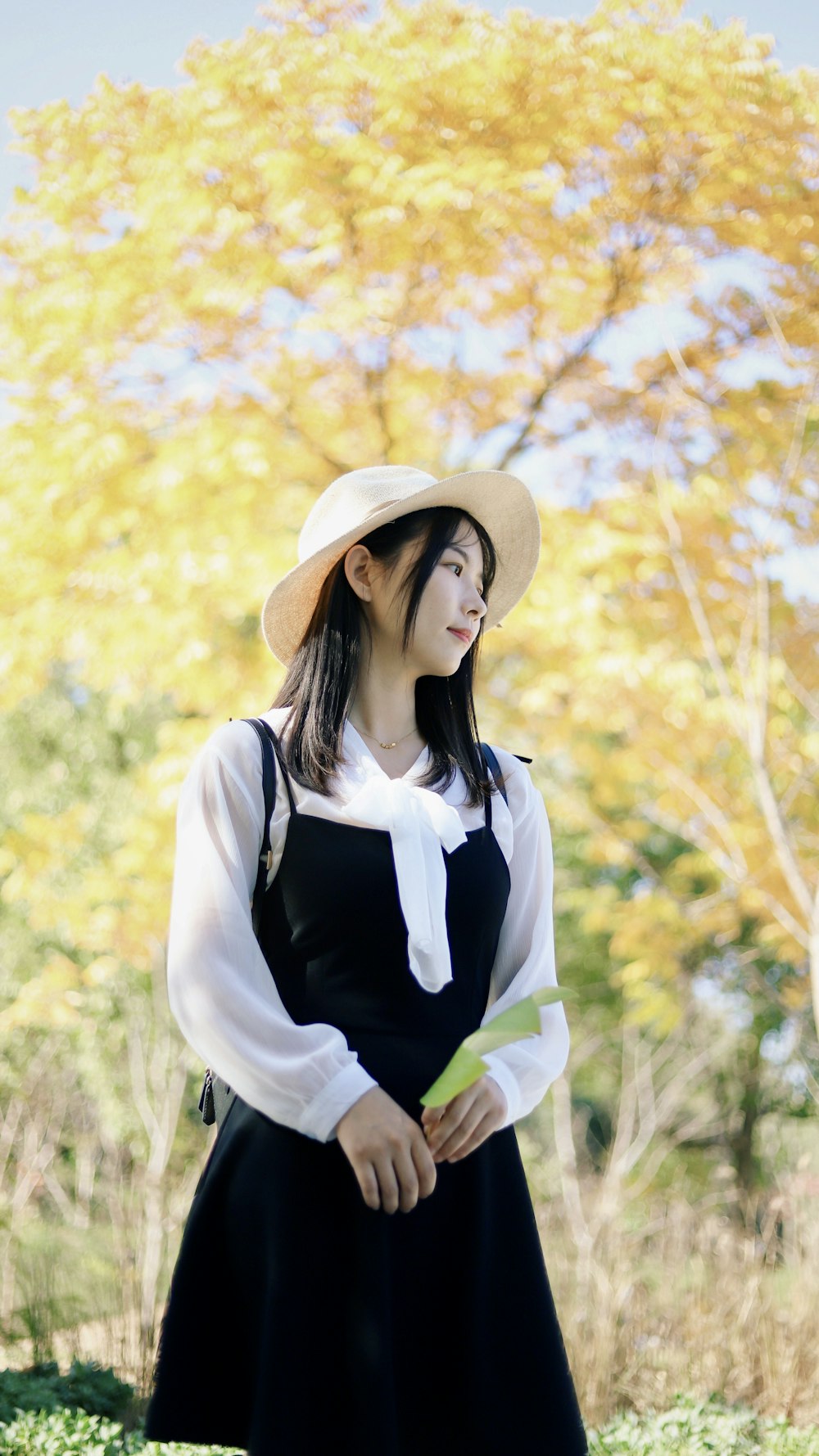 woman standing near tree