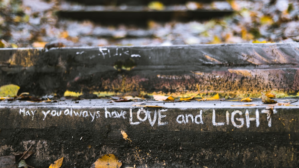 a bench that has some writing on it