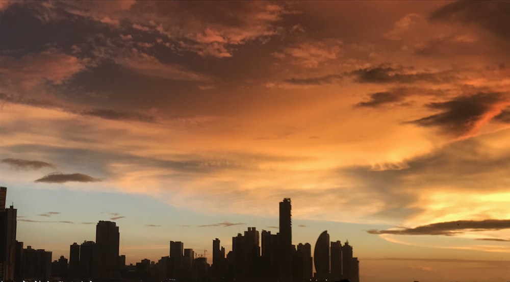 silhouette of buildings under golden hour