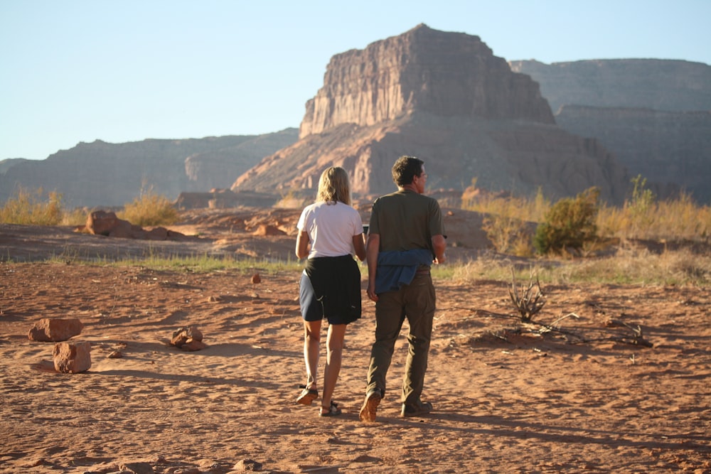 man standing beside girl