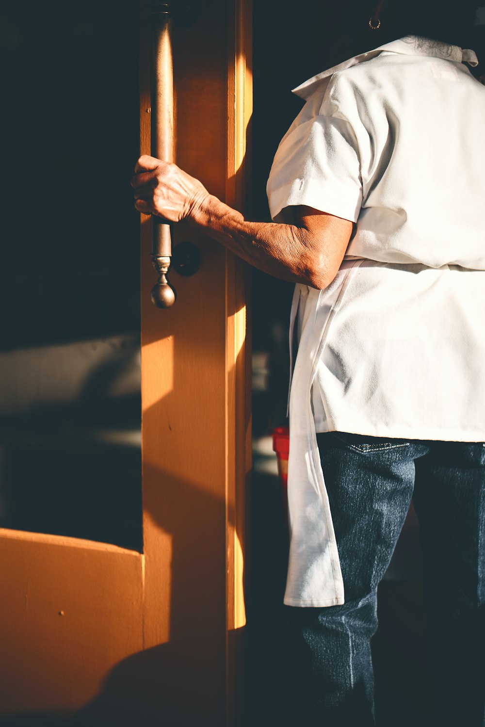 woman holding door