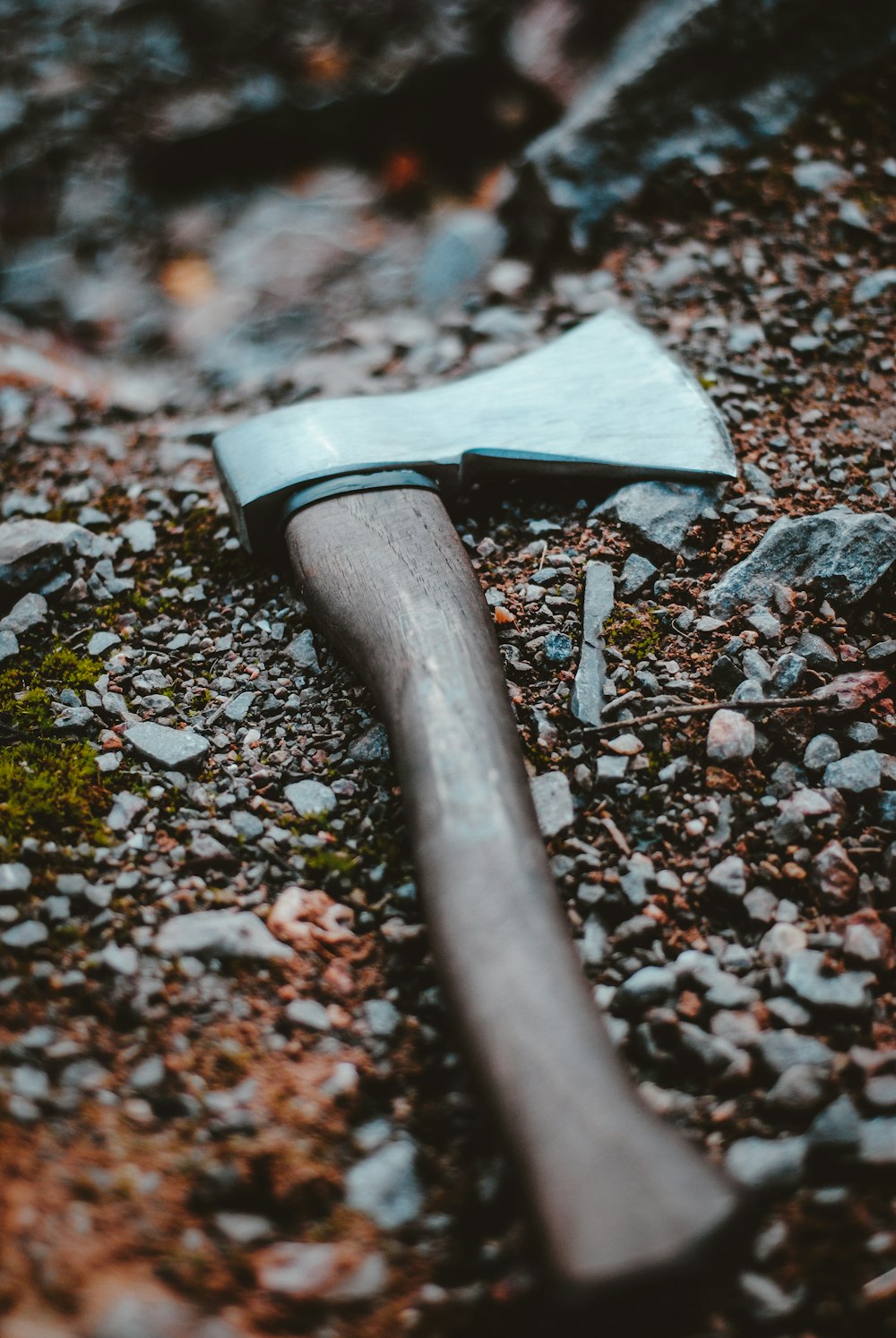 selective focus photography of ax on ground