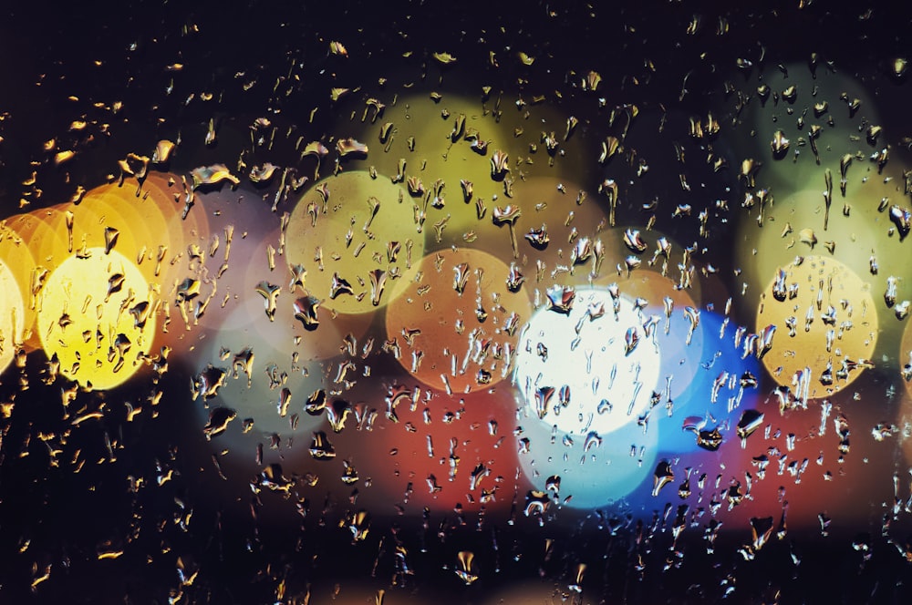 water droplets on glass panel at nighttime