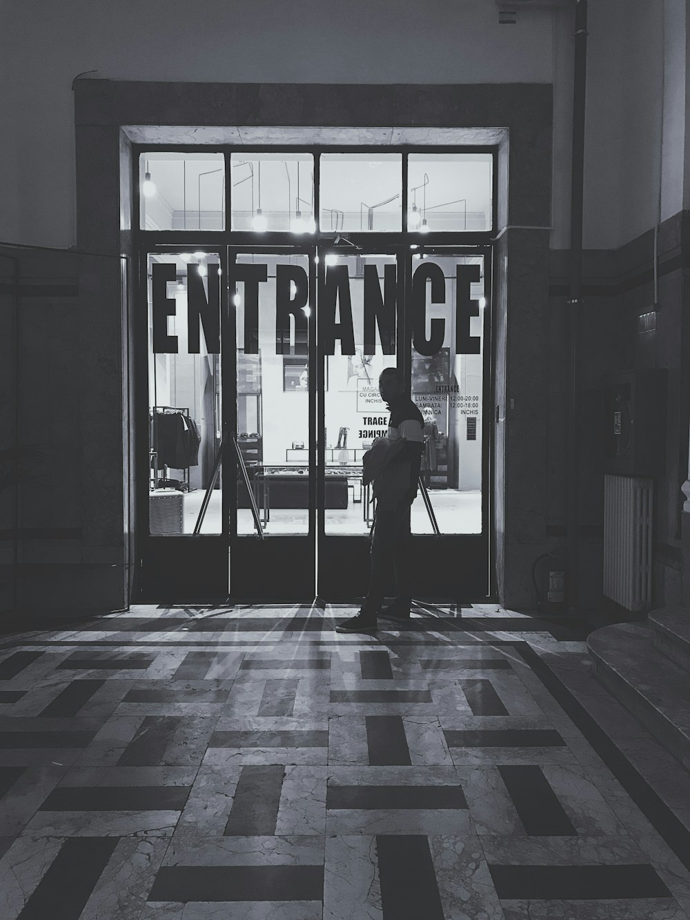 man standing near the door of the building