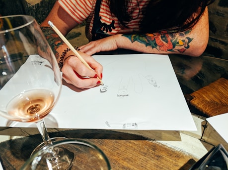 woman drawing in white paper