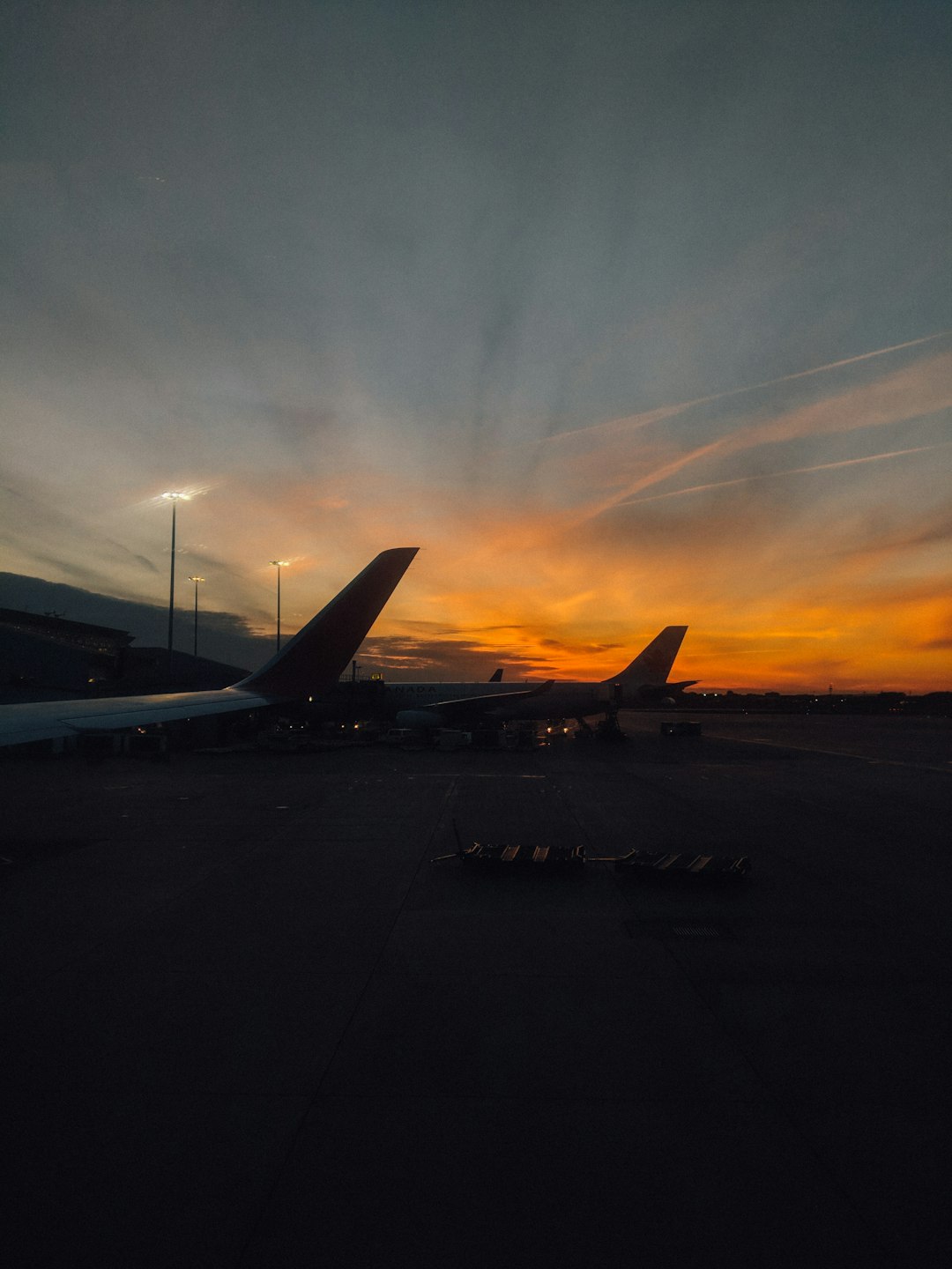 close-up photography of white airplane at golden hour