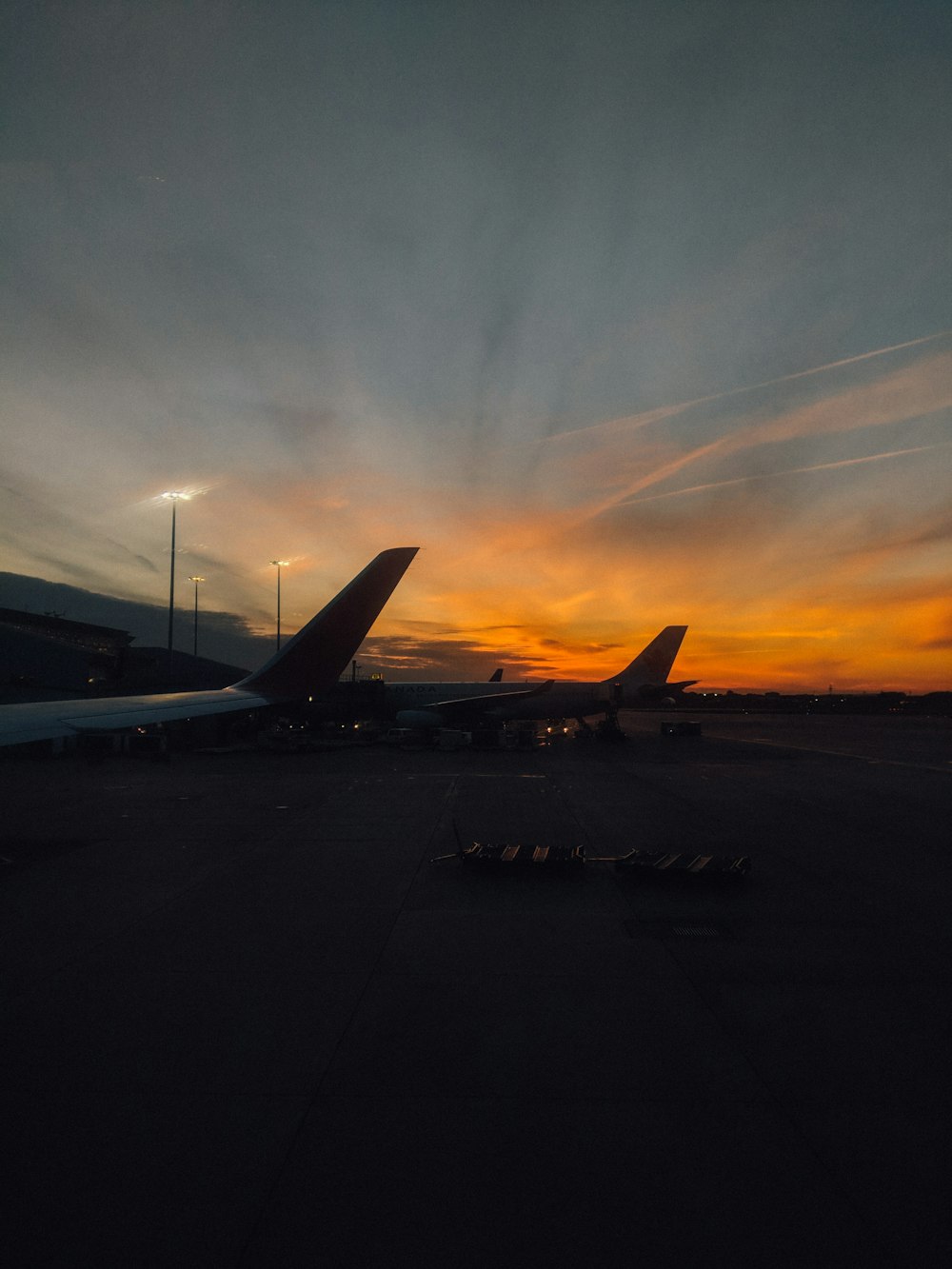 close-up photography of white airplane at golden hour