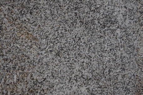 Close-up of a polished granite countertop installed in a modern kitchen.