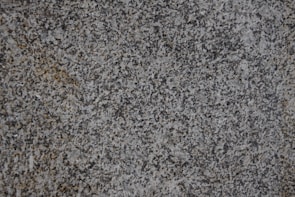 Close-up of a granite countertop with natural veining patterns.