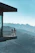 Couple enjoying a serene sunrise view from their balcony overlooking the Himalayan mountains at Vardaan Hills.