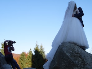 A ring ceremony captured with a beautiful backdrop and happy couple.