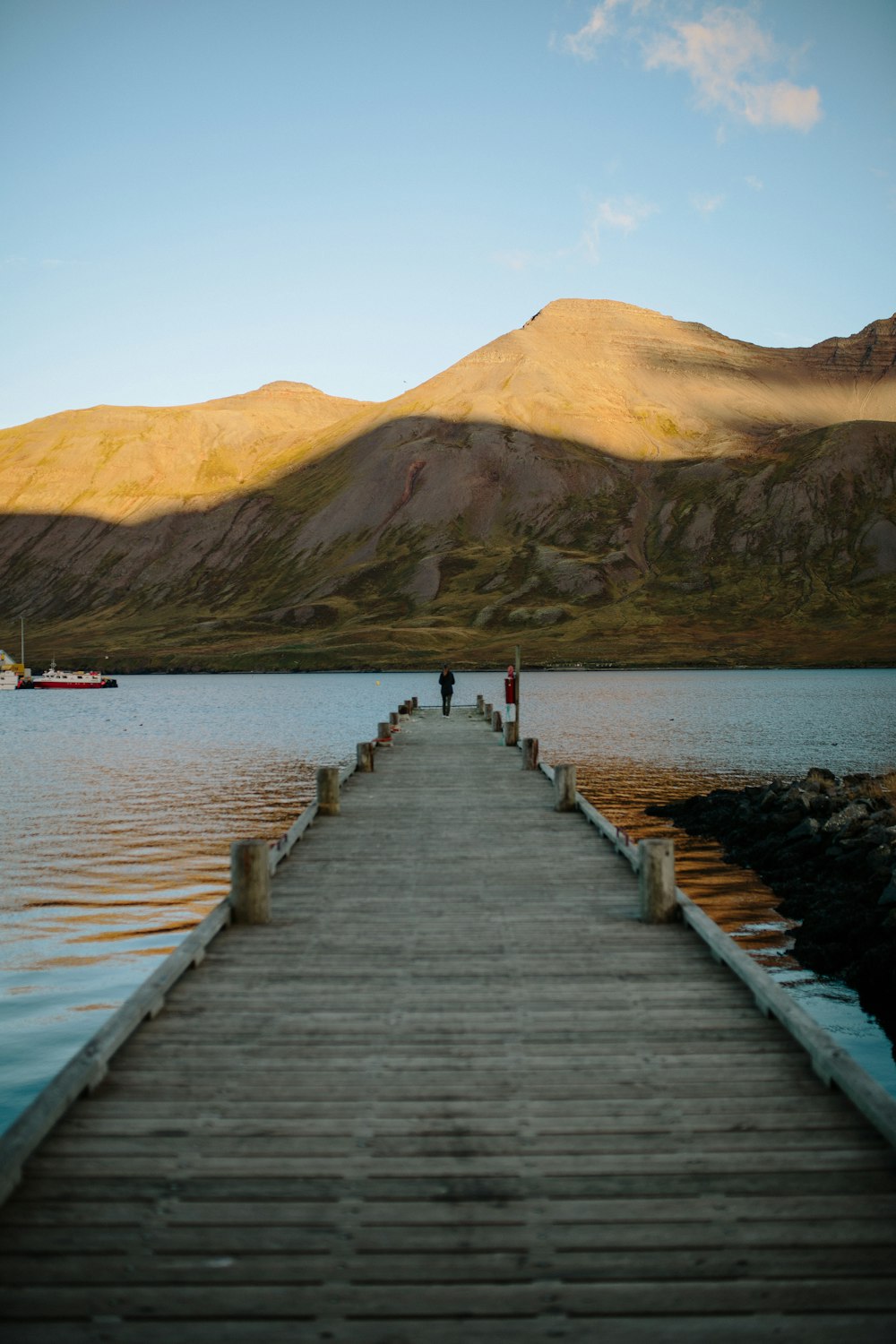 person standing at edge of dock