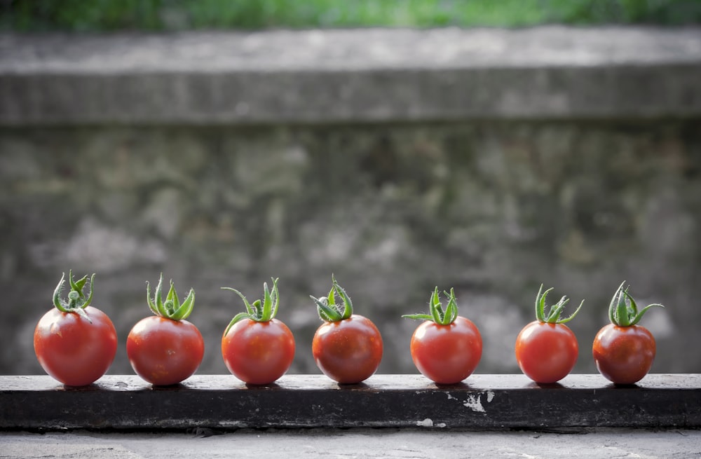 red tomatoes on black surface