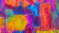 A vibrant abstract painting filled with colors and shapes.