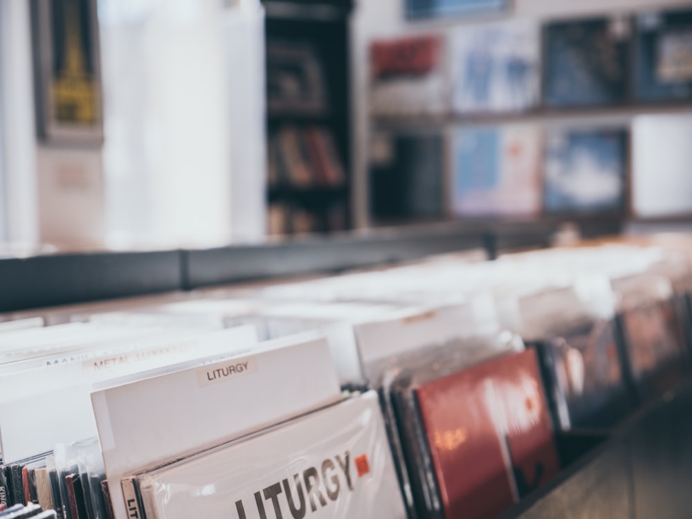 a row of dvds sitting on top of a shelf