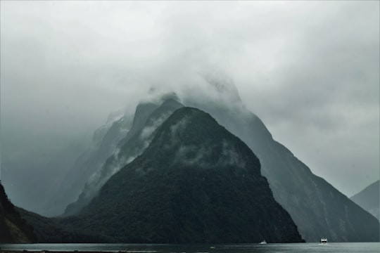 mountains covered with fog in Milford Sound New Zealand