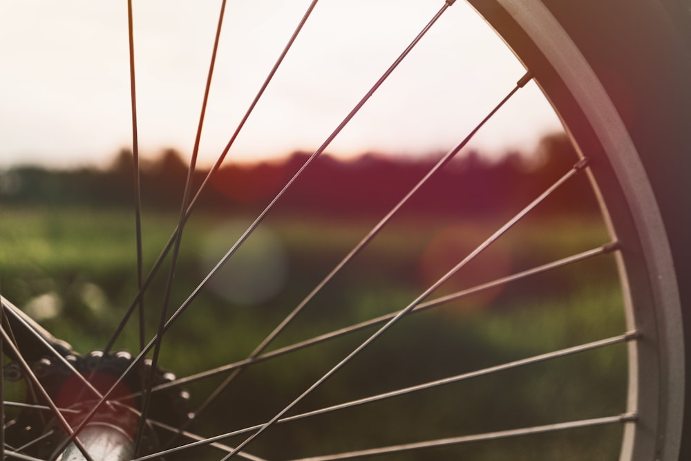 closeup photography of bicycle wheel