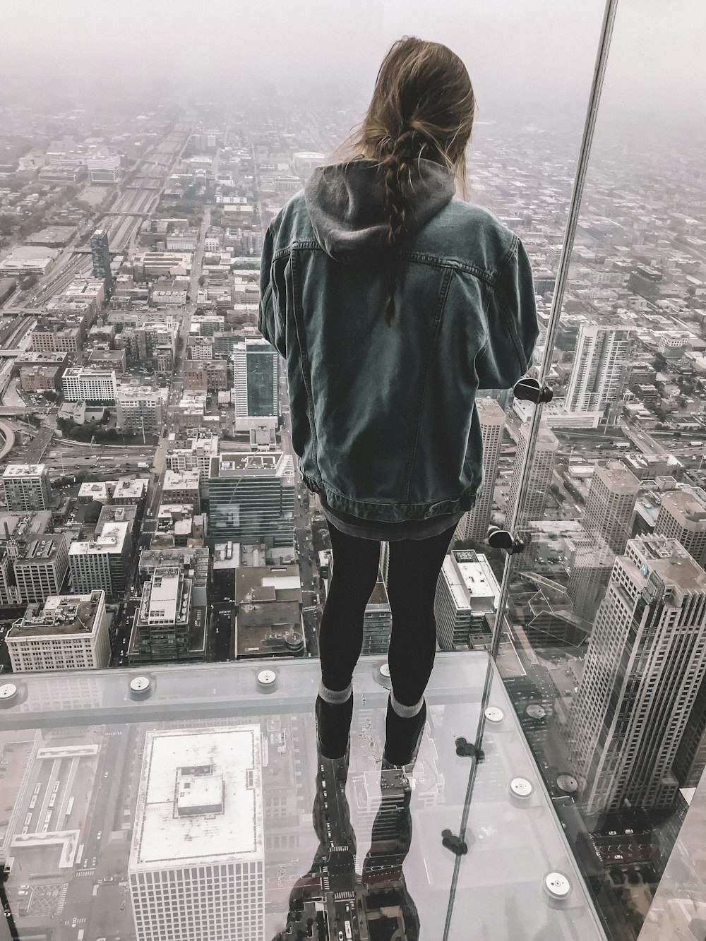 woman standing on building structure