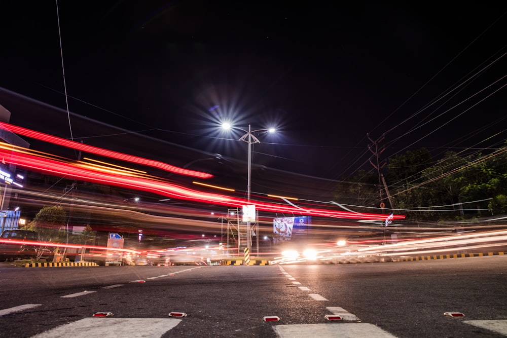 time lapse photography of cars on road during night time