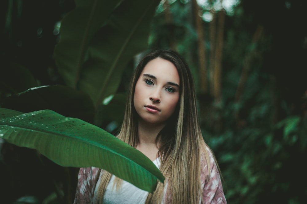 woman beside banana leaf