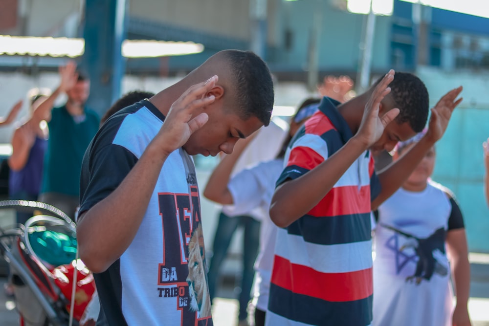 selective focus photography of people praying