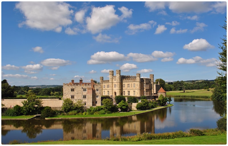 English medieval castle surrounded by gardens and a moat