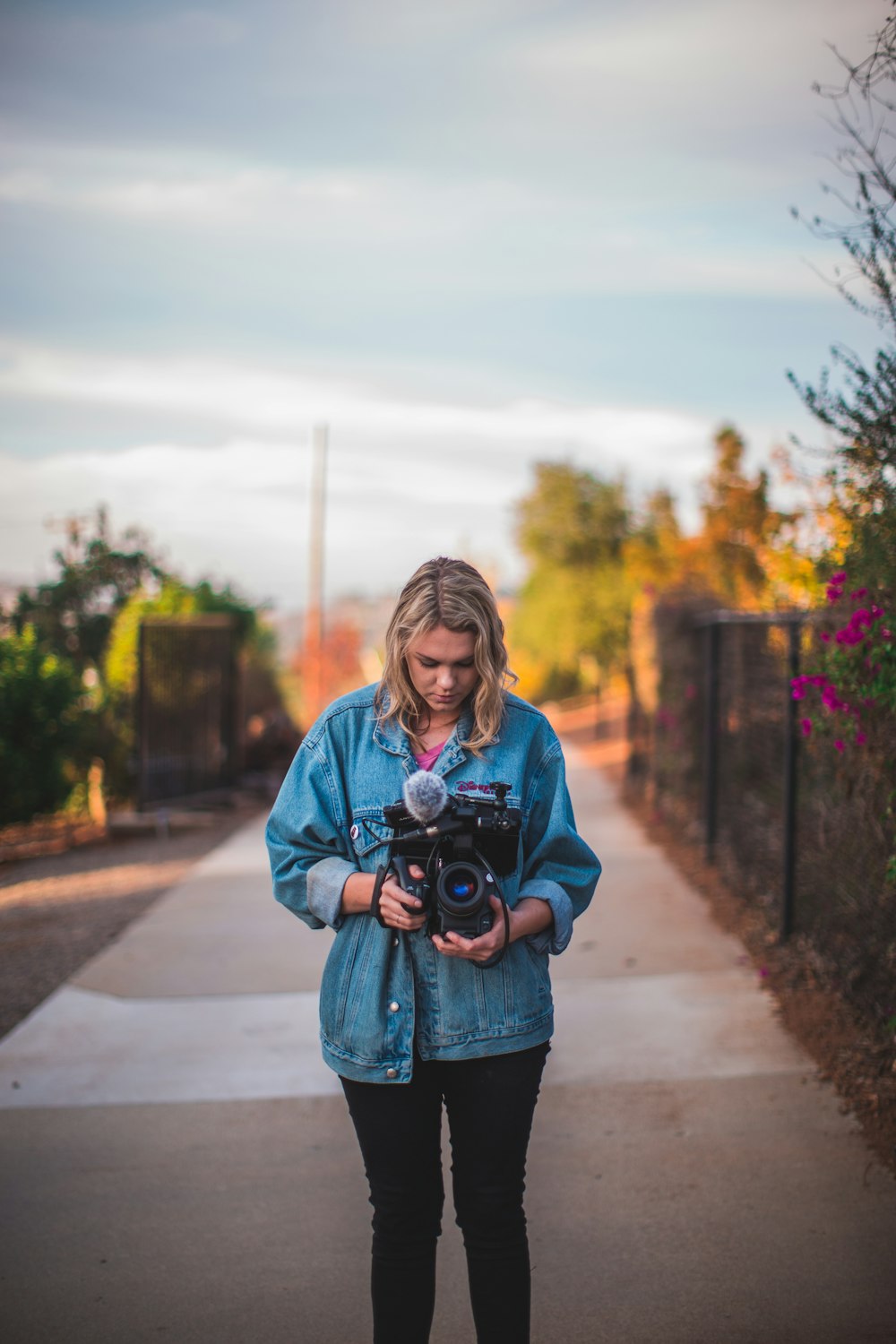 woman holding DSLR camera