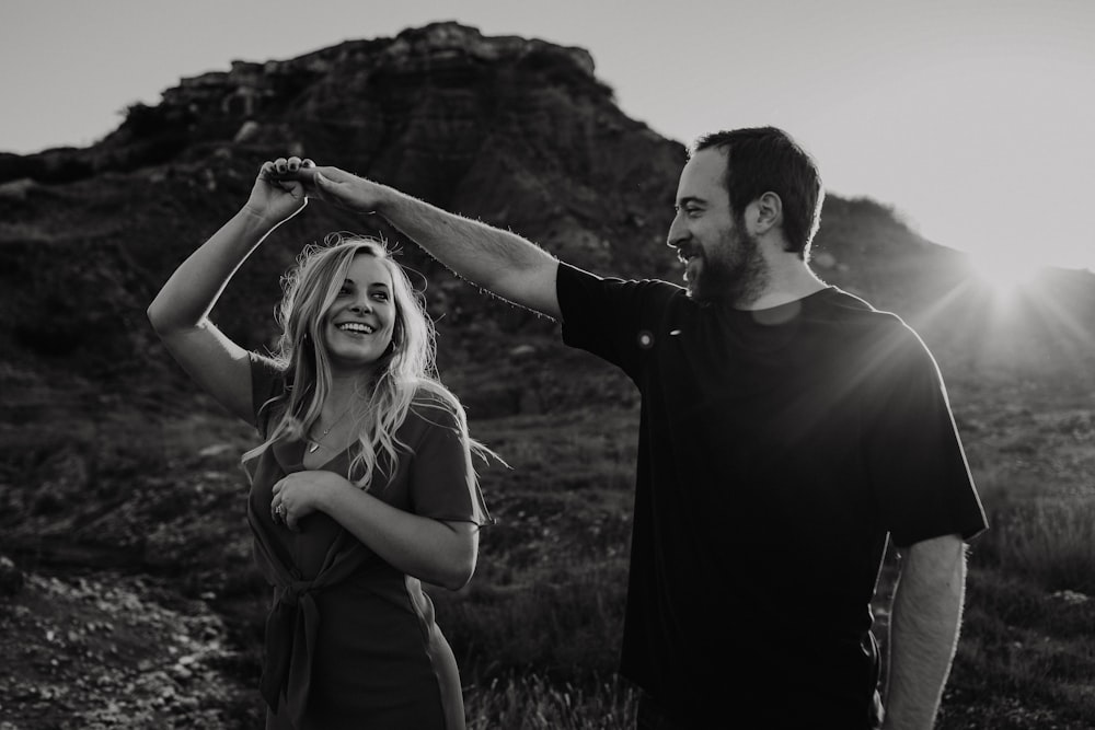 man holding woman's right hand