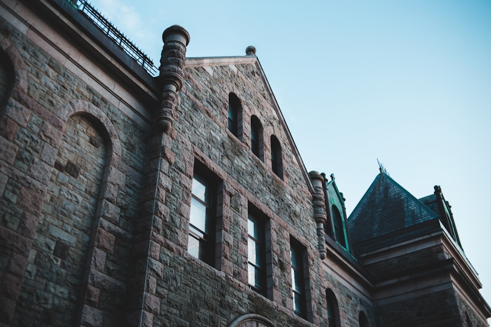 brown brick building under blue sky