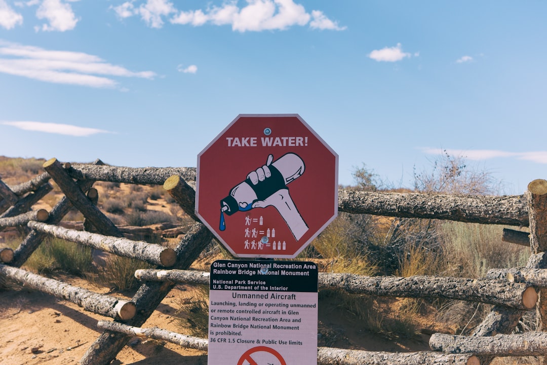 take water signage on brown fence